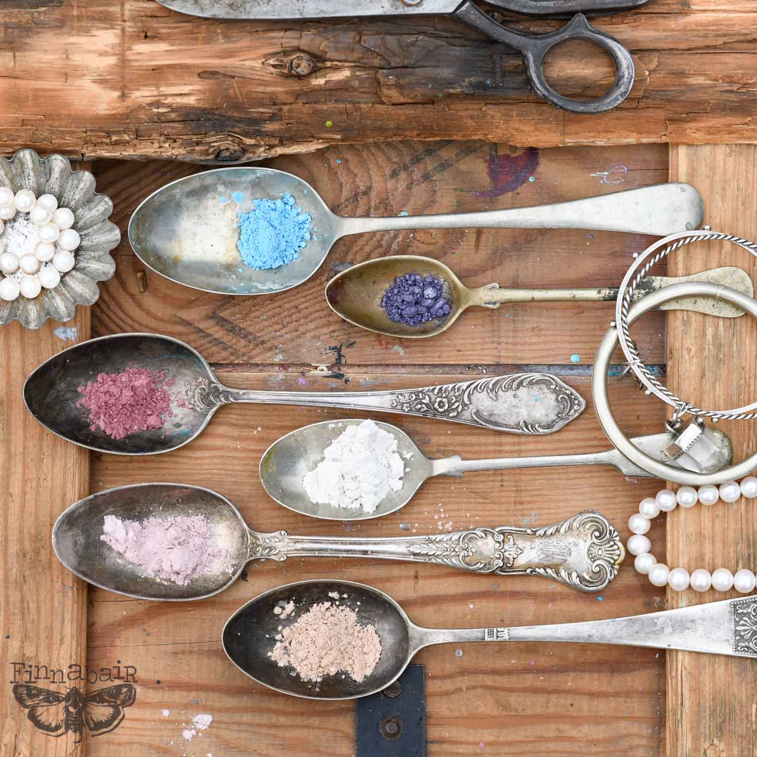 Mica Powder Set, Pearls and Crystals displayed in vintage spoons on wooden surface for creative projects and DIY décor.