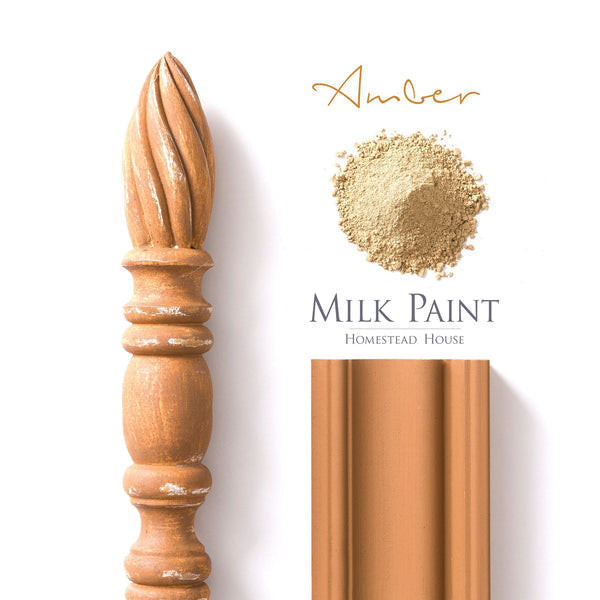 Ambre milk paint sample with a decorative wood accent and eco-conscious paint for creative projects and DIY décor.
