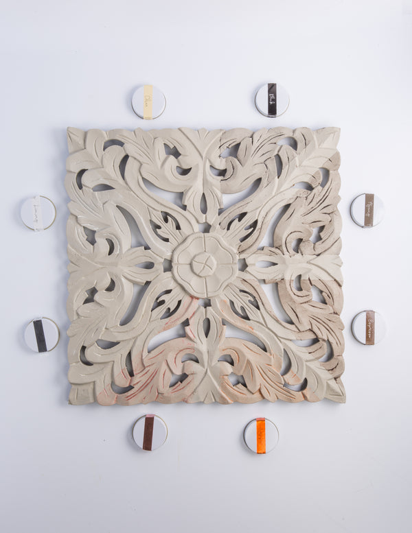 Furniture Wax used on decorative mould with paint samples for artistic finishes and DIY décor projects.