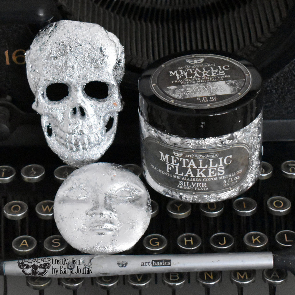 Fine Mica Flakes, Silver in jar with decorative skull and face, ideal for creative projects and DIY décor.