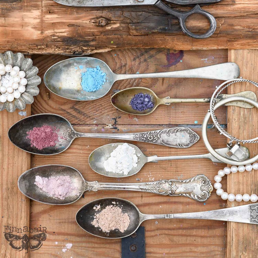 Mica Powder Set, Pearls and Crystals displayed in vintage spoons on wooden surface for creative projects and DIY décor.