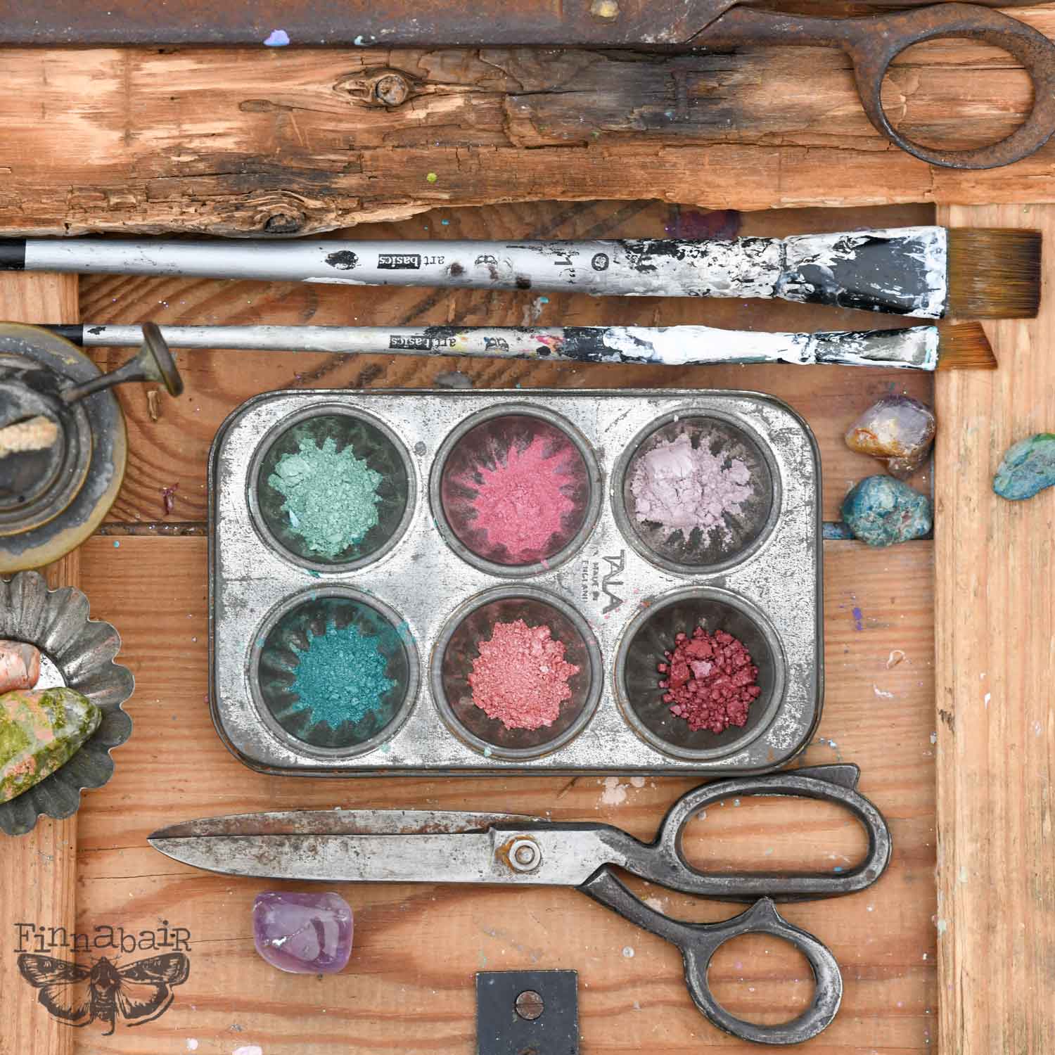 Mica Powder Set, Vintage in metal tin with art tools, including paint brushes and scissors on wooden table.